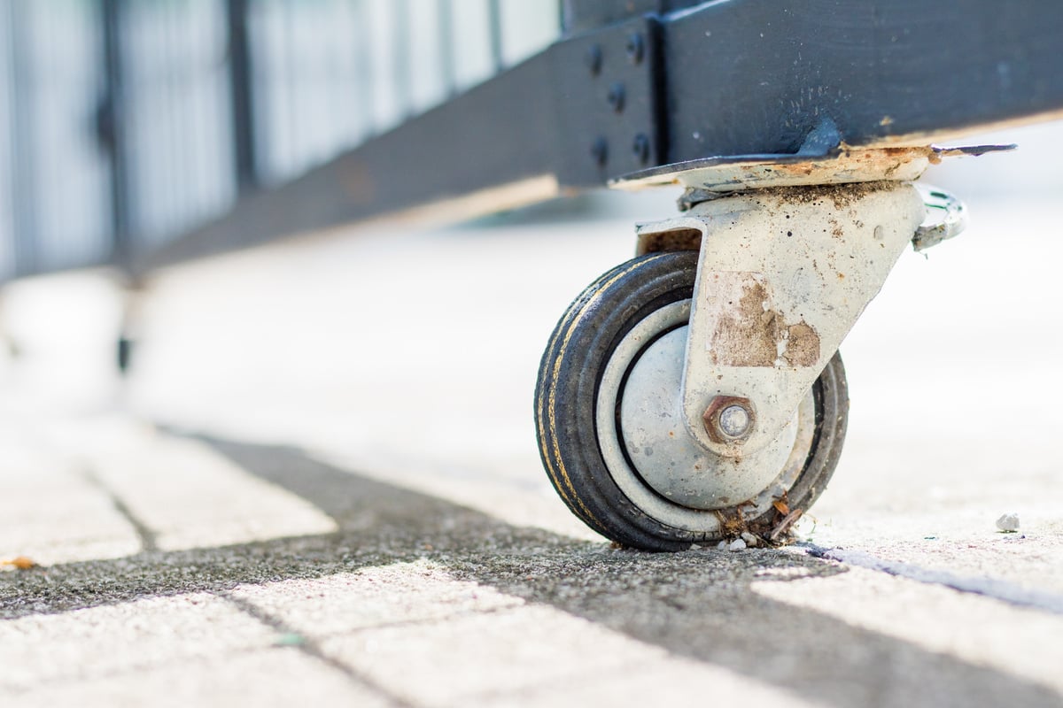 The castor rubber wheel under steel gate